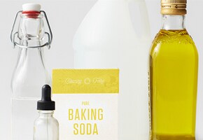 Bottle of olive oil and water, packet of Baking Soda